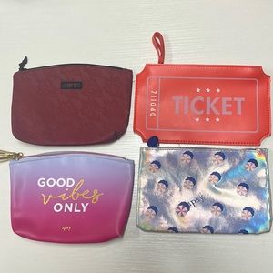 Four limited edition ipsy make up bags.